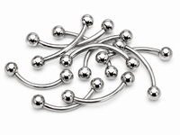 A pile of curved stainless steel labret barbell jewelry with polished ball end tips, arranged on a clean white background.
