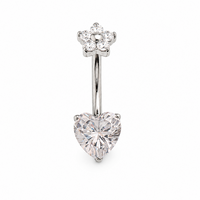 Silver belly button ring with heart-shaped gem on a white background