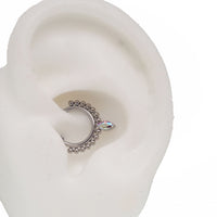 Beaded teardrop clicker ring 16g body jewelry with intricate bead detailing, designed for easy wear and stylish body piercing.
