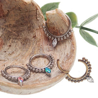 Beaded teardrop clicker ring 16g body jewelry by Body Clickers, featuring colorful beads and a sleek teardrop design.