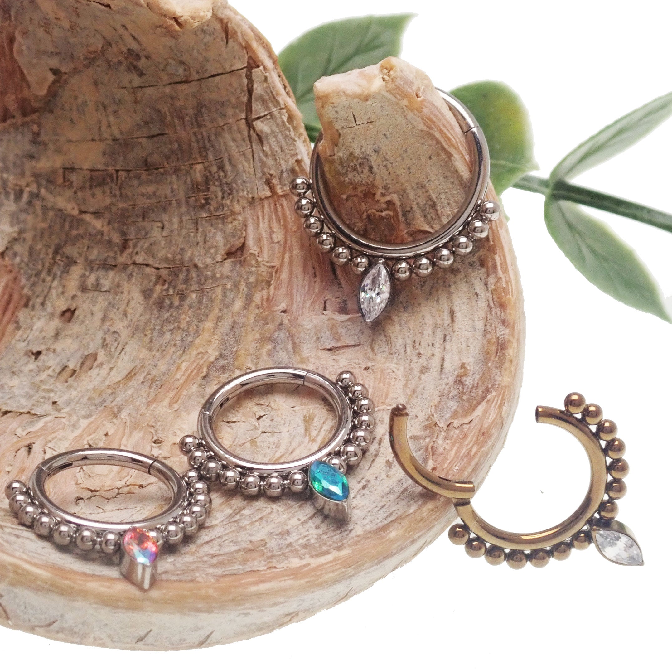 Beaded teardrop clicker ring 16g body jewelry by Body Clickers, featuring colorful beads and a sleek teardrop design.