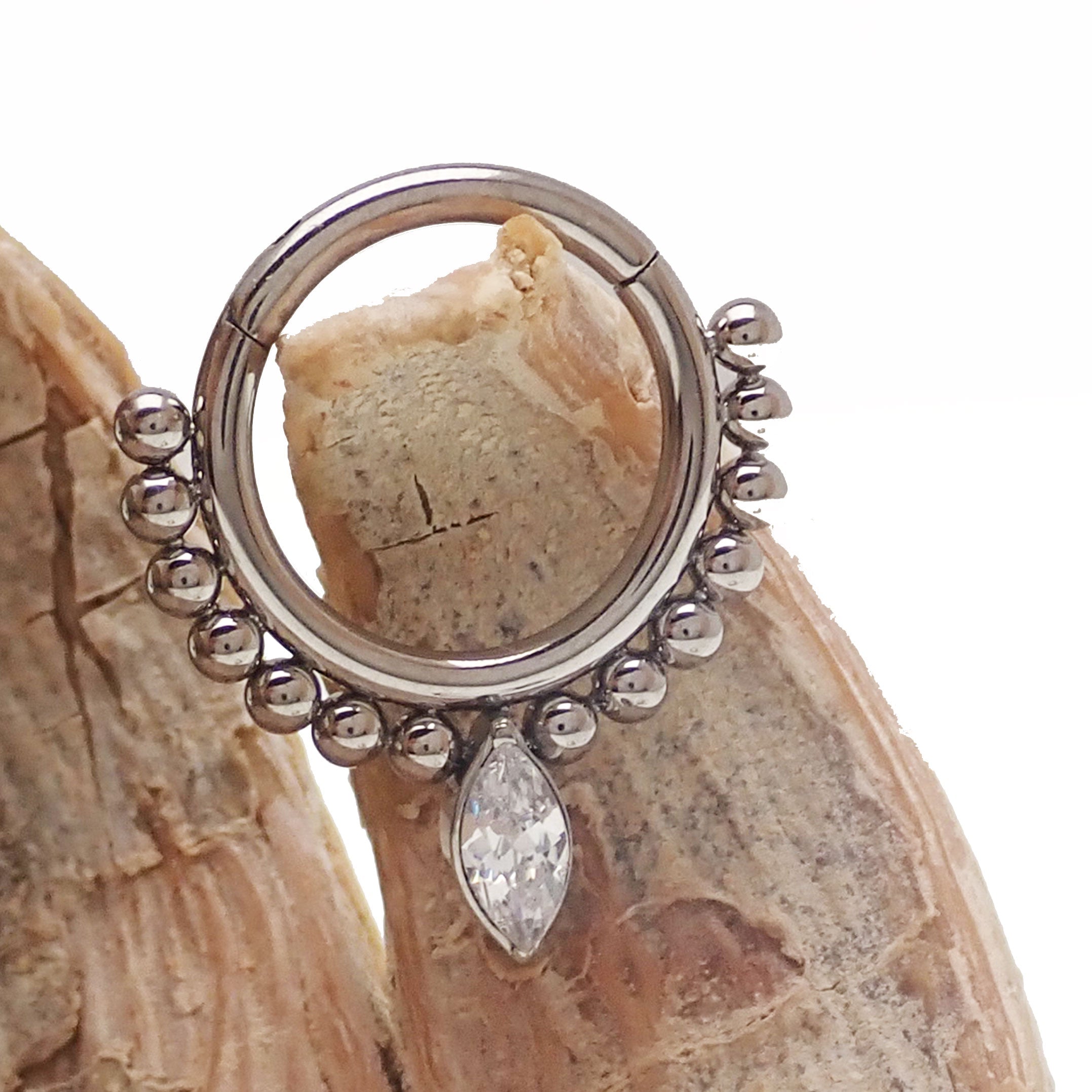 Clear beaded teardrop clicker ring in 16g body jewelry by Body Clickers, featuring a delicate teardrop design with beaded accents.