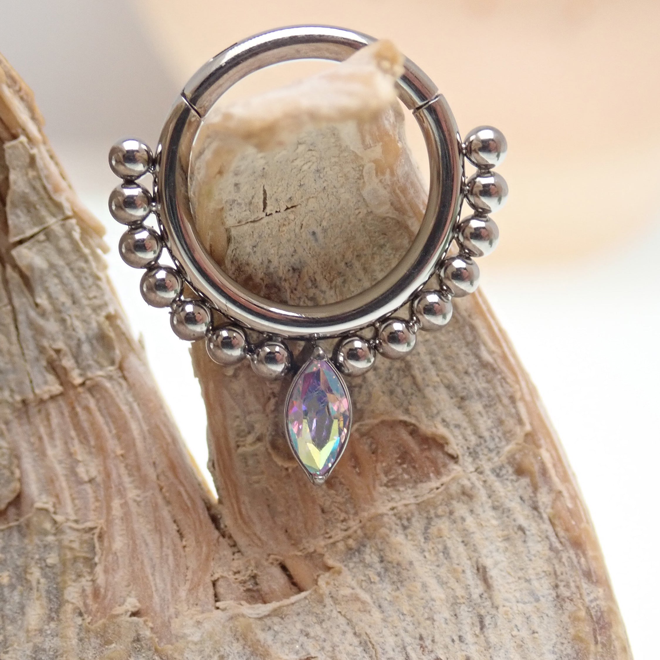 Beaded titanium teardrop clicker ring body jewelry 16g by Body Clickers, featuring intricate beaded design and sleek teardrop shape.
