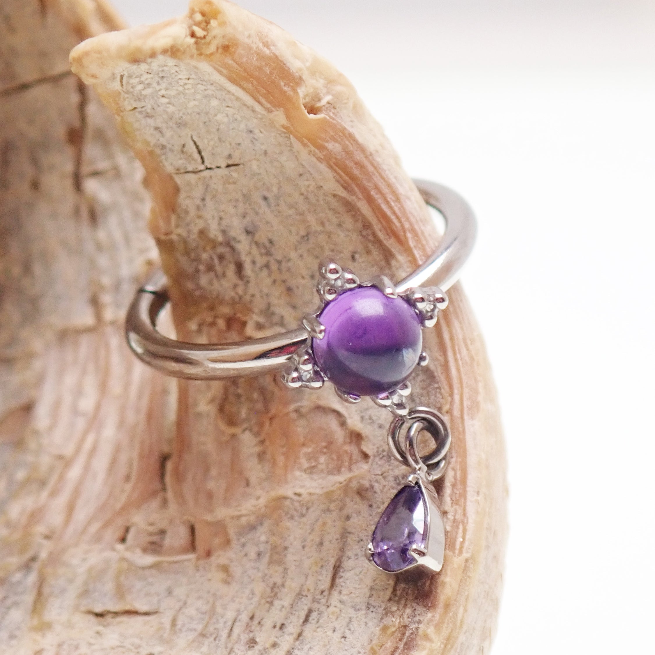 Implant grade titanium amethyst hinge clicker body jewelry in 16g with 8mm or 10mm size, featuring a secure hinge design.