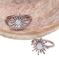 Implant grade titanium white opal sun hinge clicker body jewelry in 16g with 8mm or 10mm diameter.
